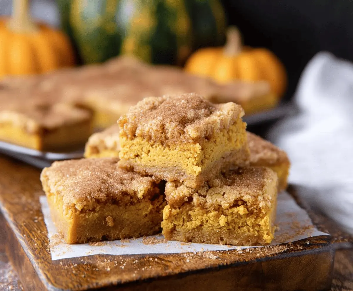 Delicious Pumpkin Snickerdoodle Bars topped with cinnamon sugar, perfect for fall desserts and holiday gatherings.