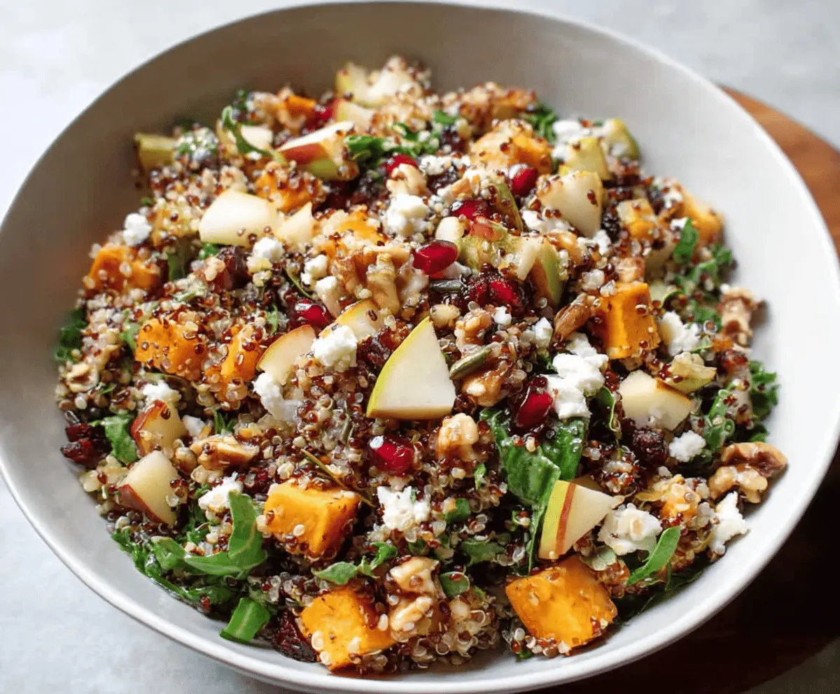 Colorful Fall Harvest Quinoa Salad with roasted vegetables, cranberries, and toasted nuts served in a bowl, perfect for autumn meals