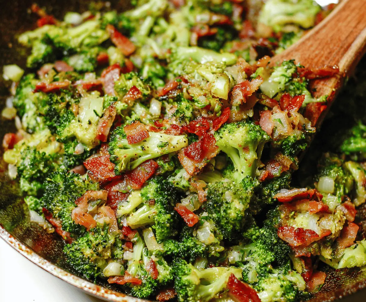 Pan-fried garlic bacon broccoli dish featuring crispy bacon, sautéed broccoli florets, and fragrant garlic for a delicious, healthy side or main course.