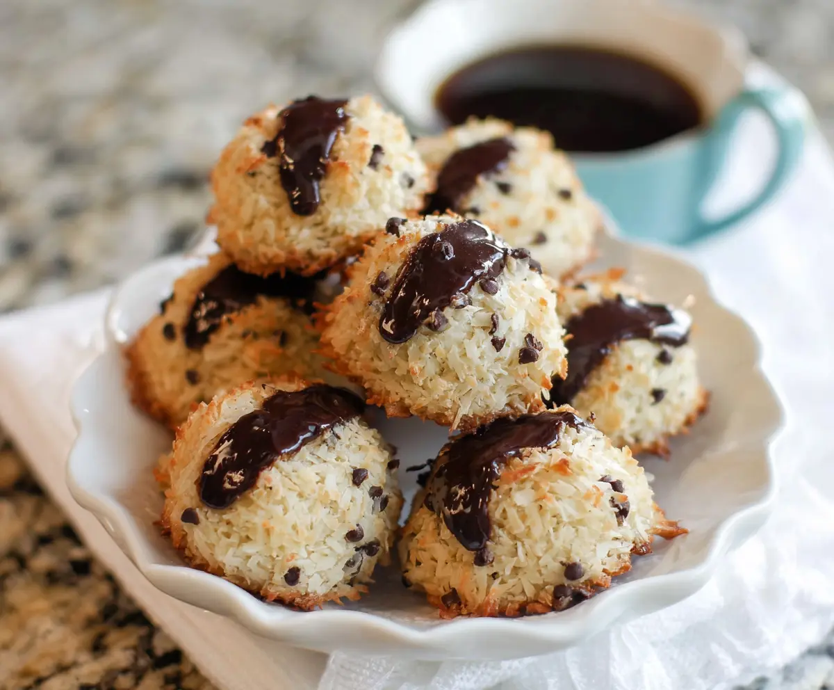 Delicious chocolate chip coconut macaroons on a white plate, perfect for a sweet treat.