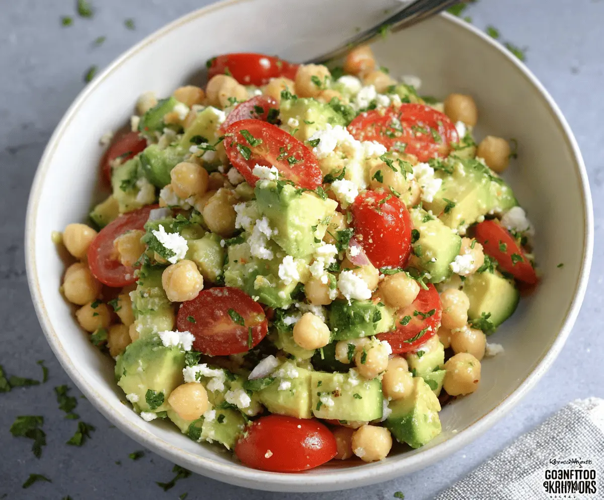 Delicious Feta Avocado Chickpea Salad with fresh vegetables and creamy cheese for a healthy meal.