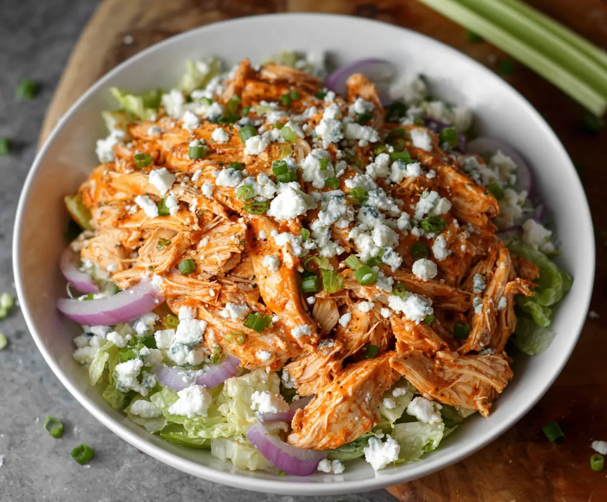 Delicious buffalo chicken salad with fresh vegetables and spicy buffalo sauce.