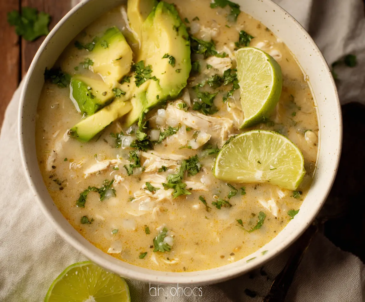 Delicious Whole30 White Chicken Chili in a bowl with tender chicken and creamy white beans.