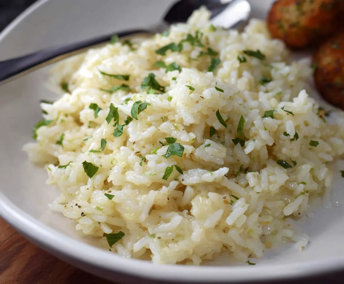 Delicious Garlic Parmesan Rice served as a flavorful side dish.
